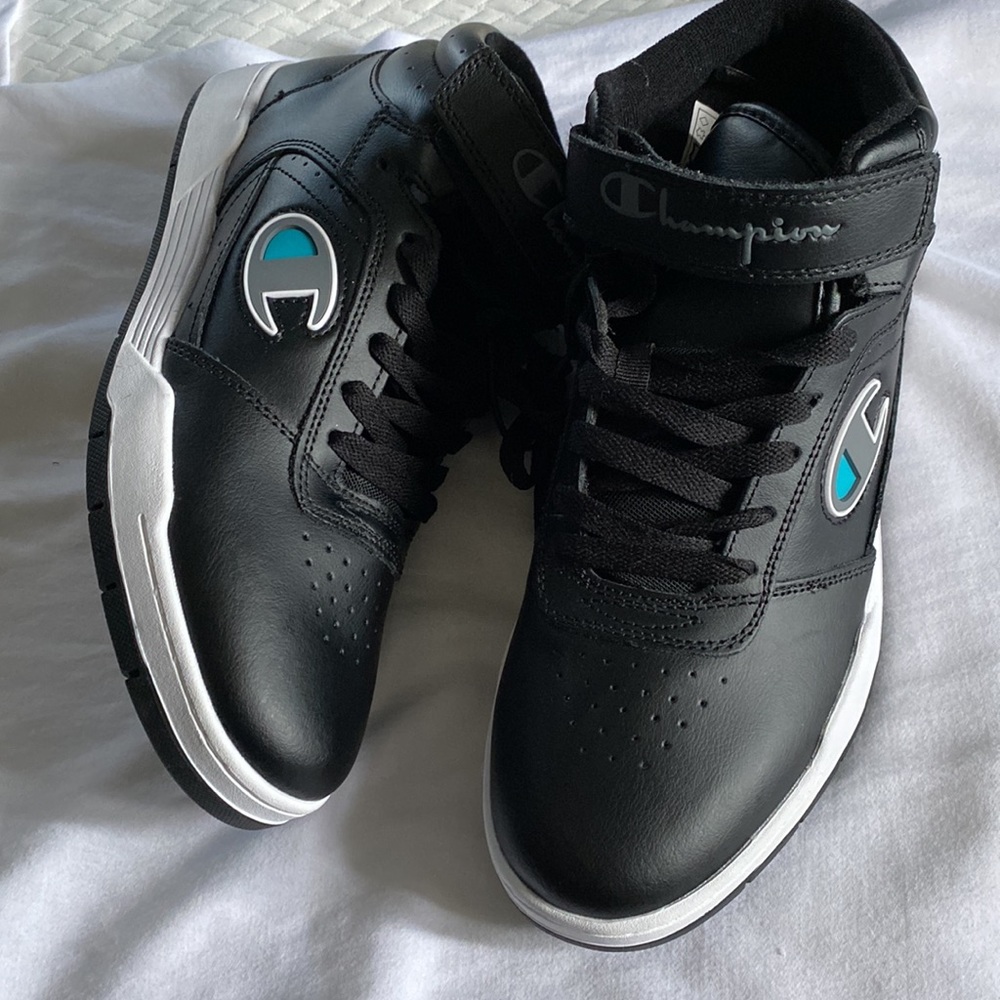 Men’s champion leather sneakers brand new without tags.